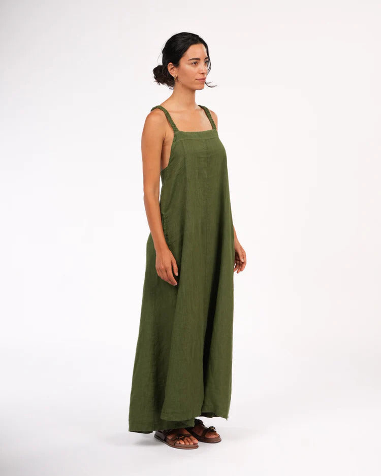 Woman wearing a green dress on a white background