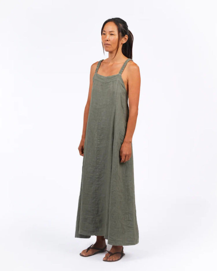 Woman wearing a green dress on a white background